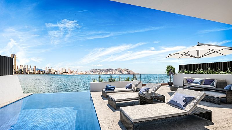 Located in the charming town of La Vila Joiosa, this townhouse offers a unique living experience wit
