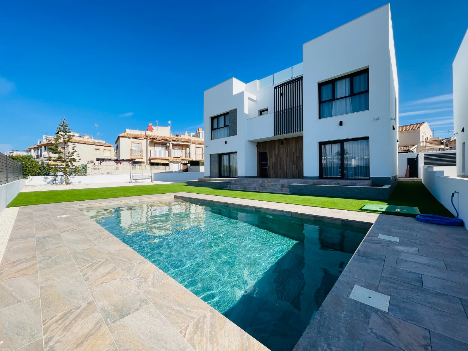 Located in the charming town of Torrevieja, this exclusive real estate offer presents two detached h