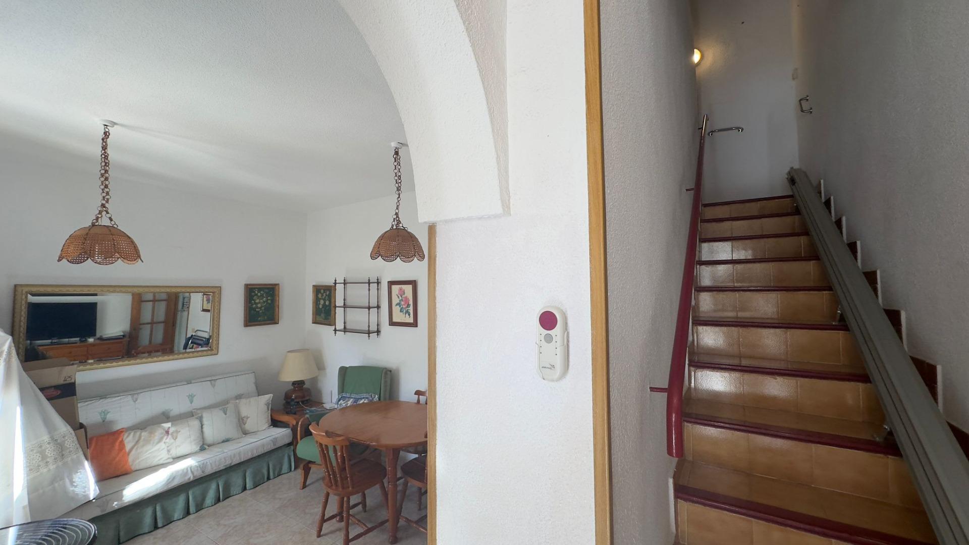 This charming two-bedroom, one-bathroom townhouse, located in the tranquil and sought-after Calas Bl