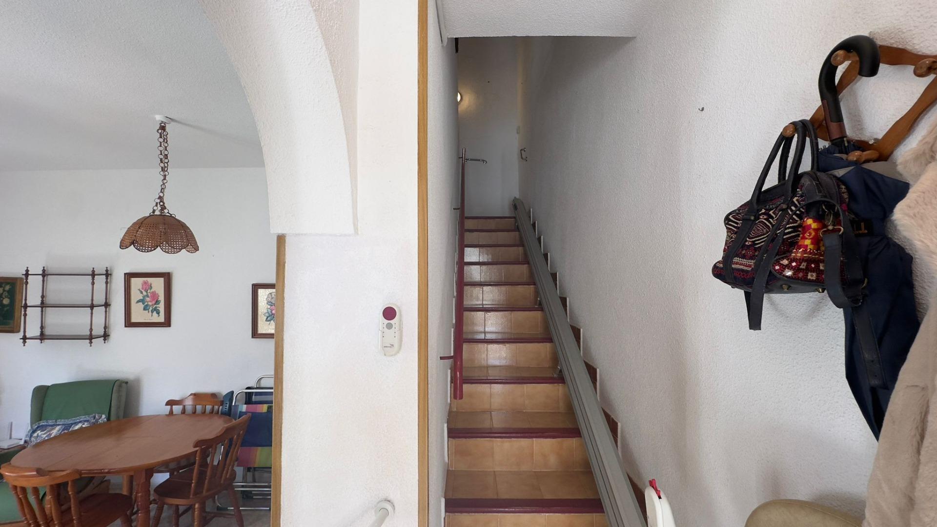 This charming two-bedroom, one-bathroom townhouse, located in the tranquil and sought-after Calas Bl