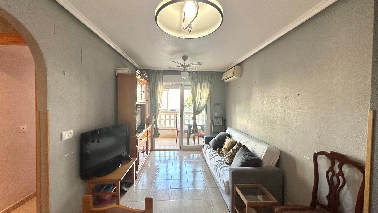 Geräumige Wohnung im Erdgeschoss mit Gemeinschaftspool und verglaster Südterrasse Diese wunderschöne