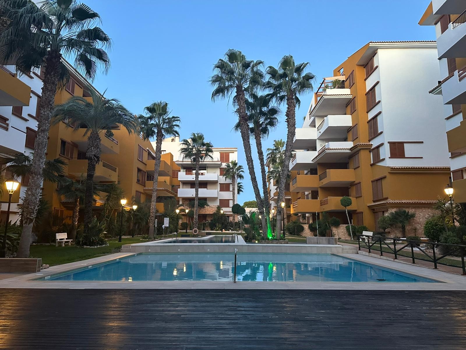 Pool area in apartment for sale in Punta Prima