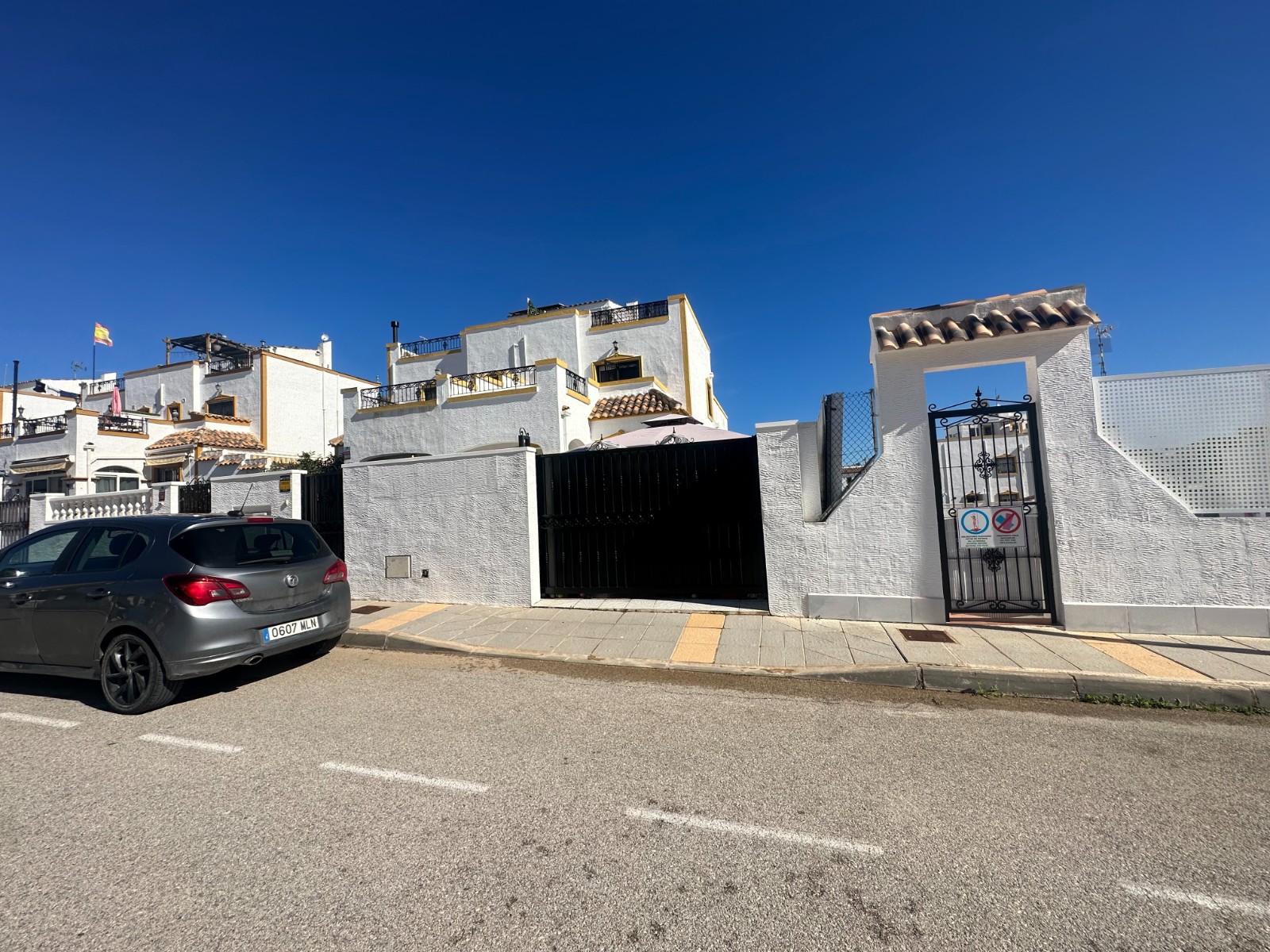 This beautifully presented townhouse welcomes you with a southwest-facing private front garden, perf