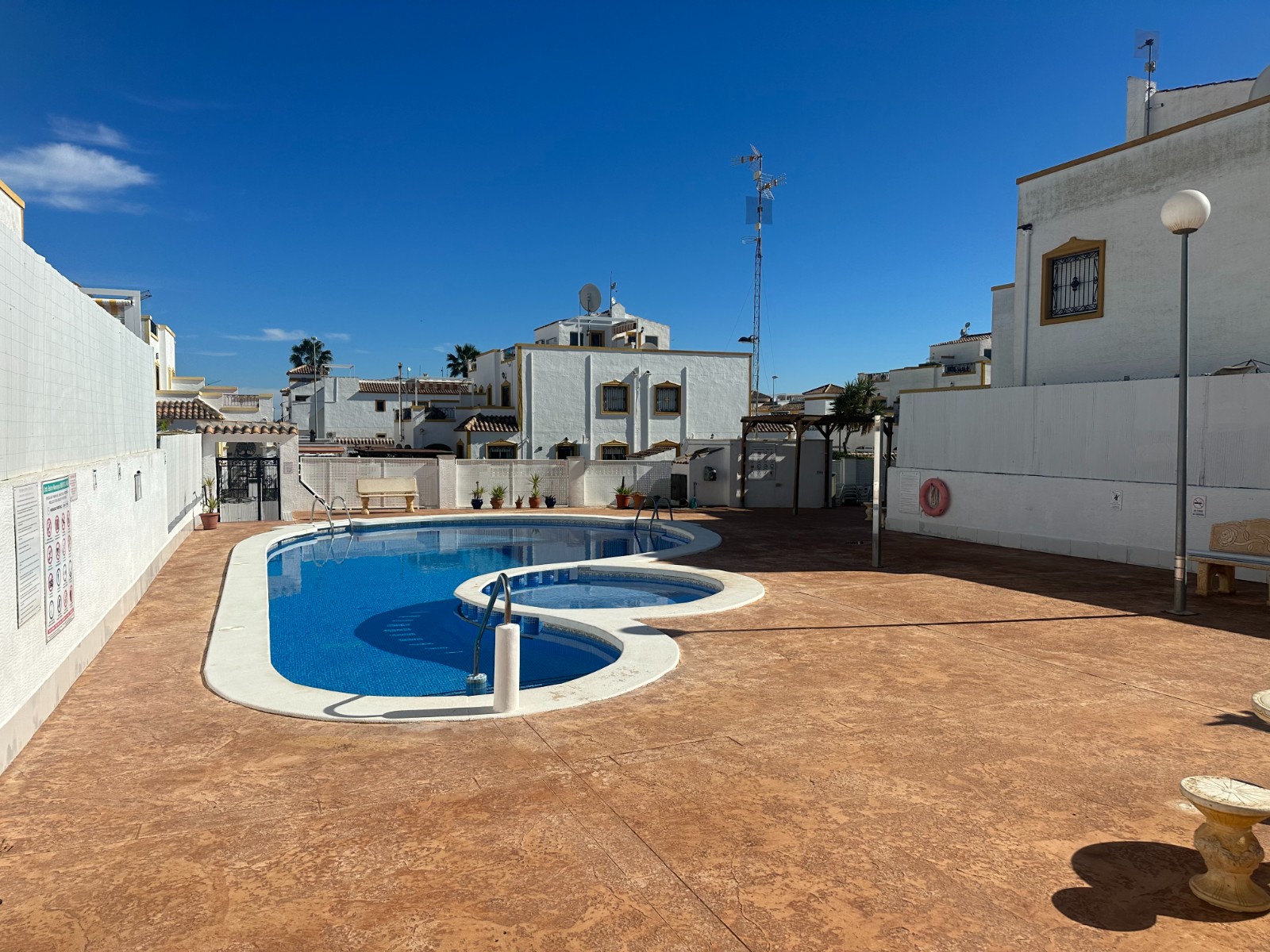 This beautifully presented townhouse welcomes you with a southwest-facing private front garden, perf