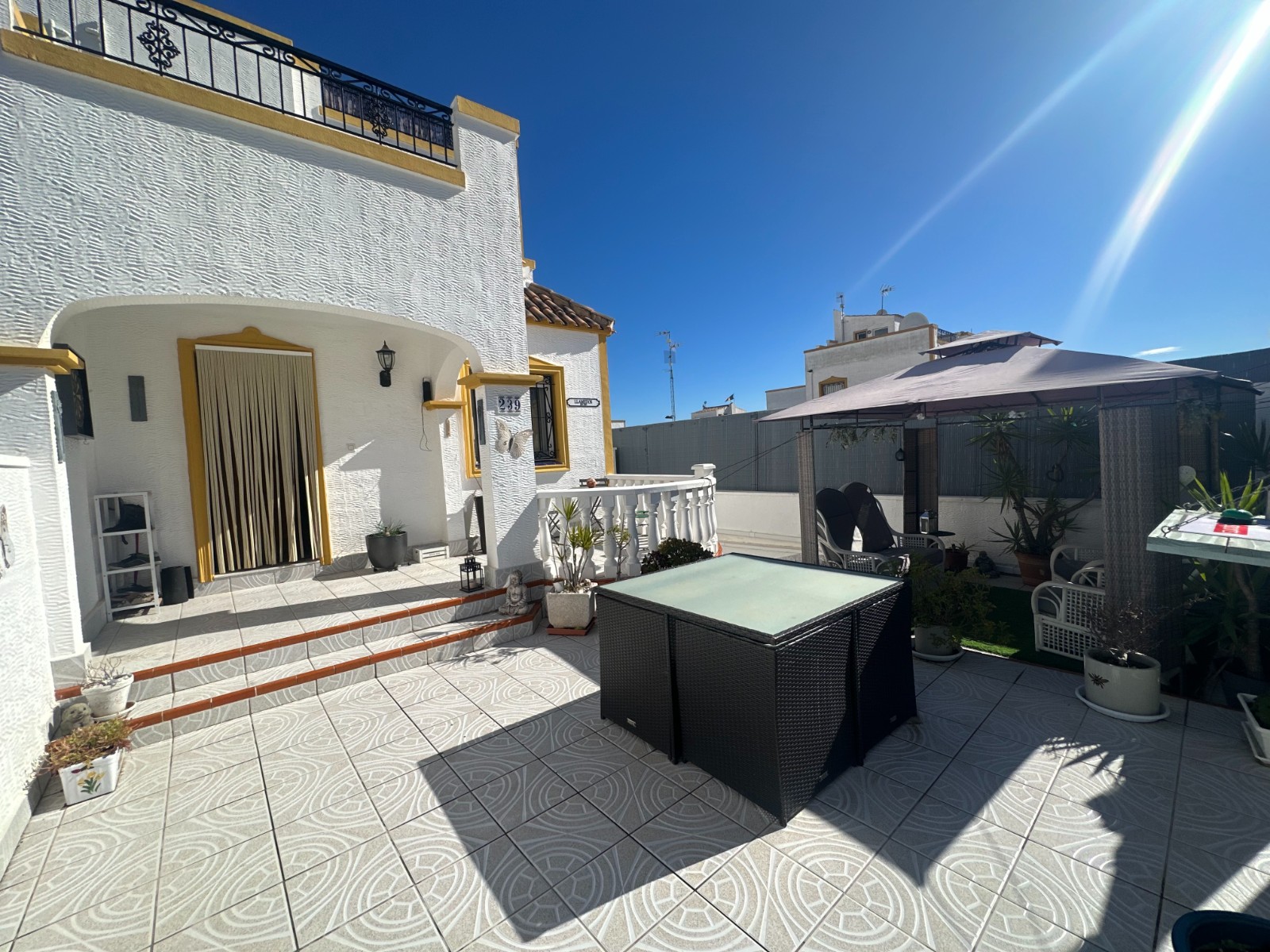 This beautifully presented townhouse welcomes you with a southwest-facing private front garden, perf