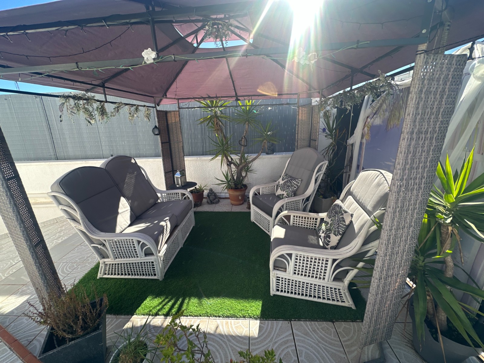 This beautifully presented townhouse welcomes you with a southwest-facing private front garden, perf
