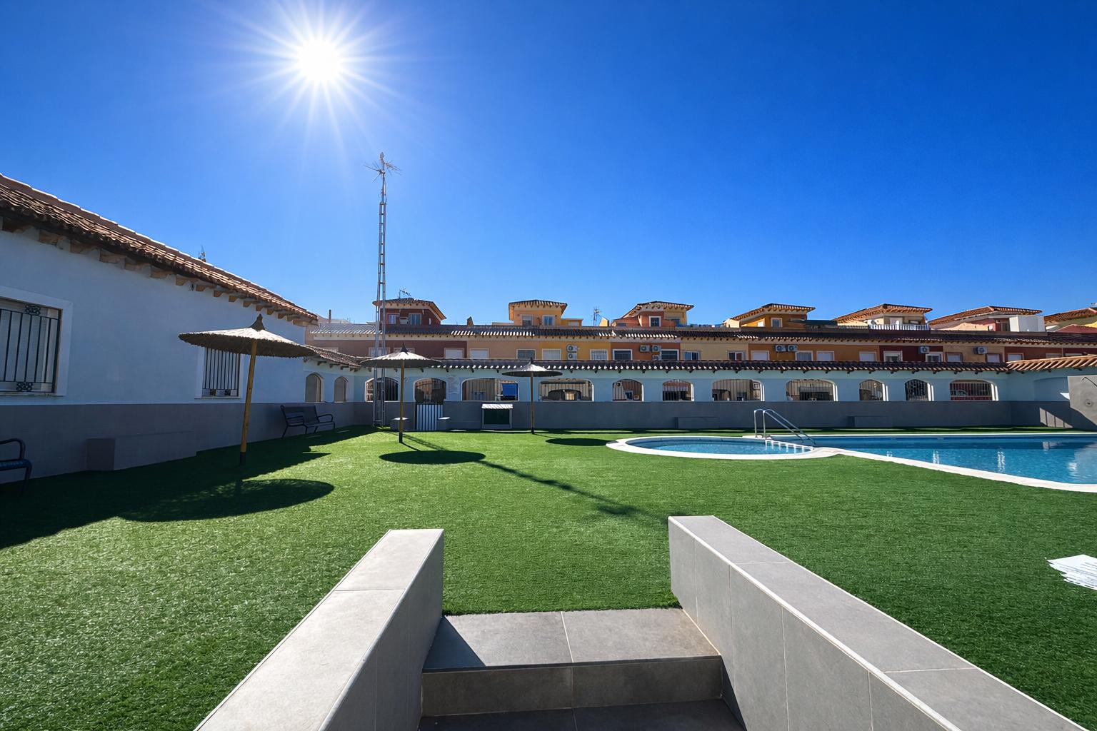 Pool area in bungalow for sale in Torrevieja