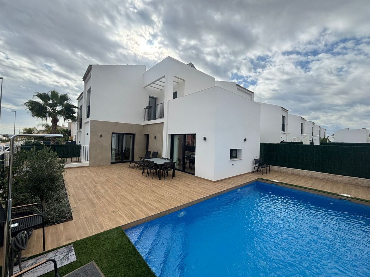This contemporary semi-detached villa, completed in 2024, is offered for sale as an exceptional resa