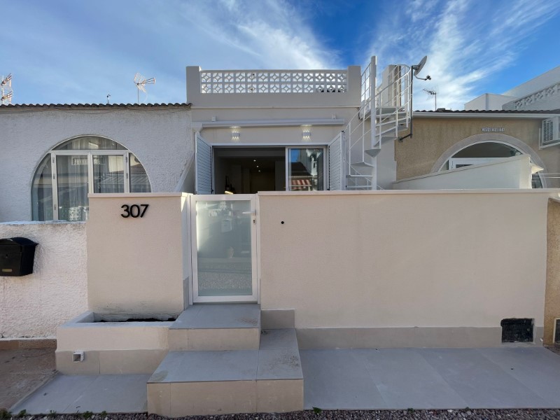 Discover this beautifully fully renovated 2-bedroom, 1-bathroom bungalow, ideally situated on one le