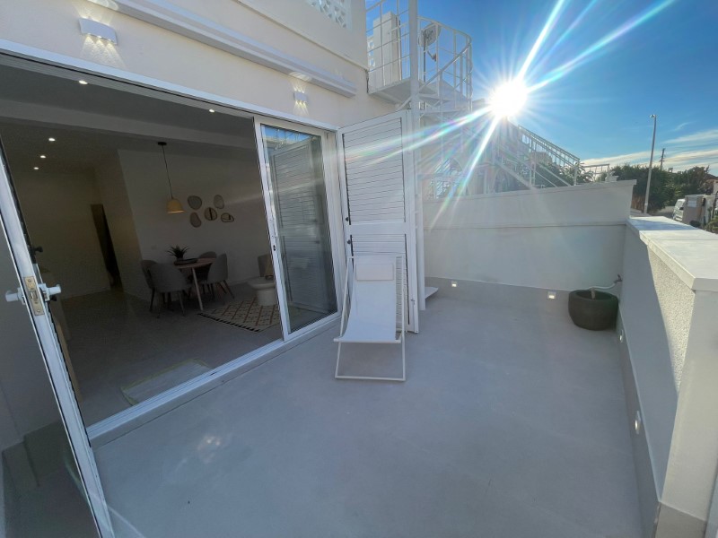 Discover this beautifully fully renovated 2-bedroom, 1-bathroom bungalow, ideally situated on one le