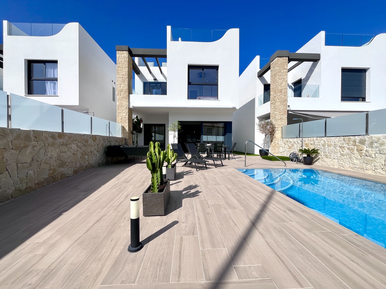 Experience modern coastal living at its finest in this exceptional resale new-build villa, perfectly