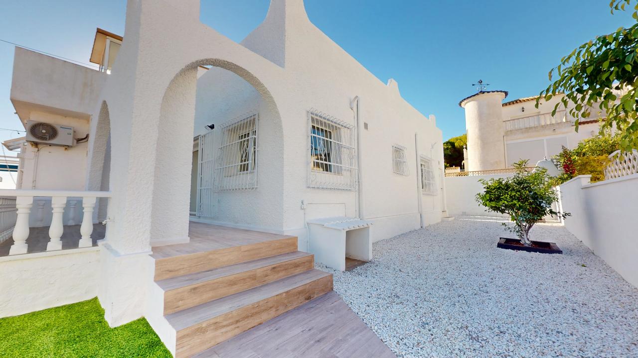 This charming renovated bungalow in Blue Lagoon offers a Mediterranean lifestyle in one of the quiet
