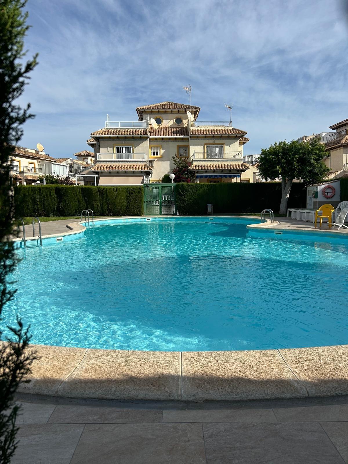 Pool area in duplex for sale in Orihuela Costa