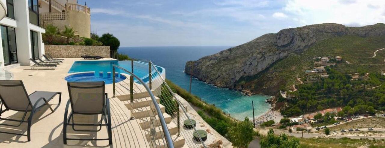 Spectacular First-Line 4-Bedroom Villa with Sea Views Near Granadella BeachNestled in an exclusive a