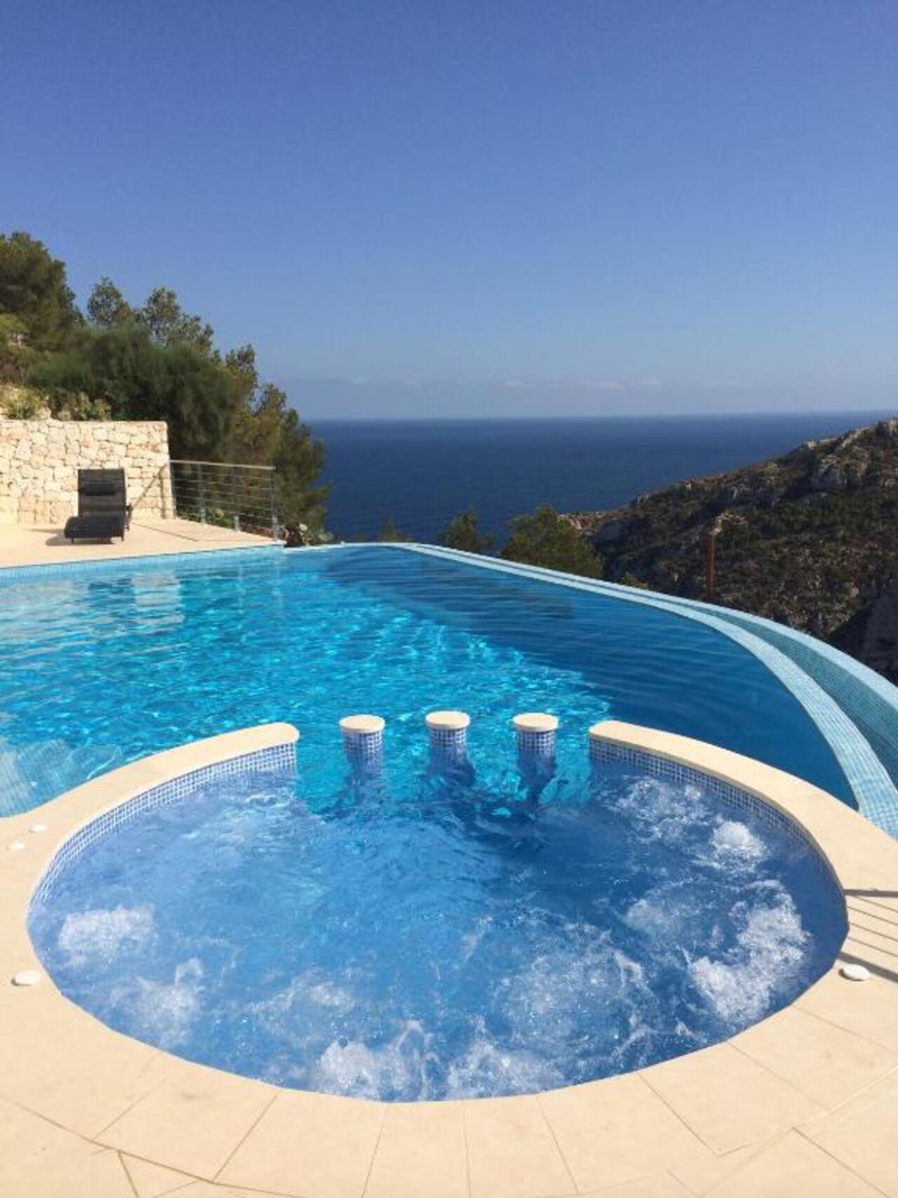 Spectacular First-Line 4-Bedroom Villa with Sea Views Near Granadella BeachNestled in an exclusive a