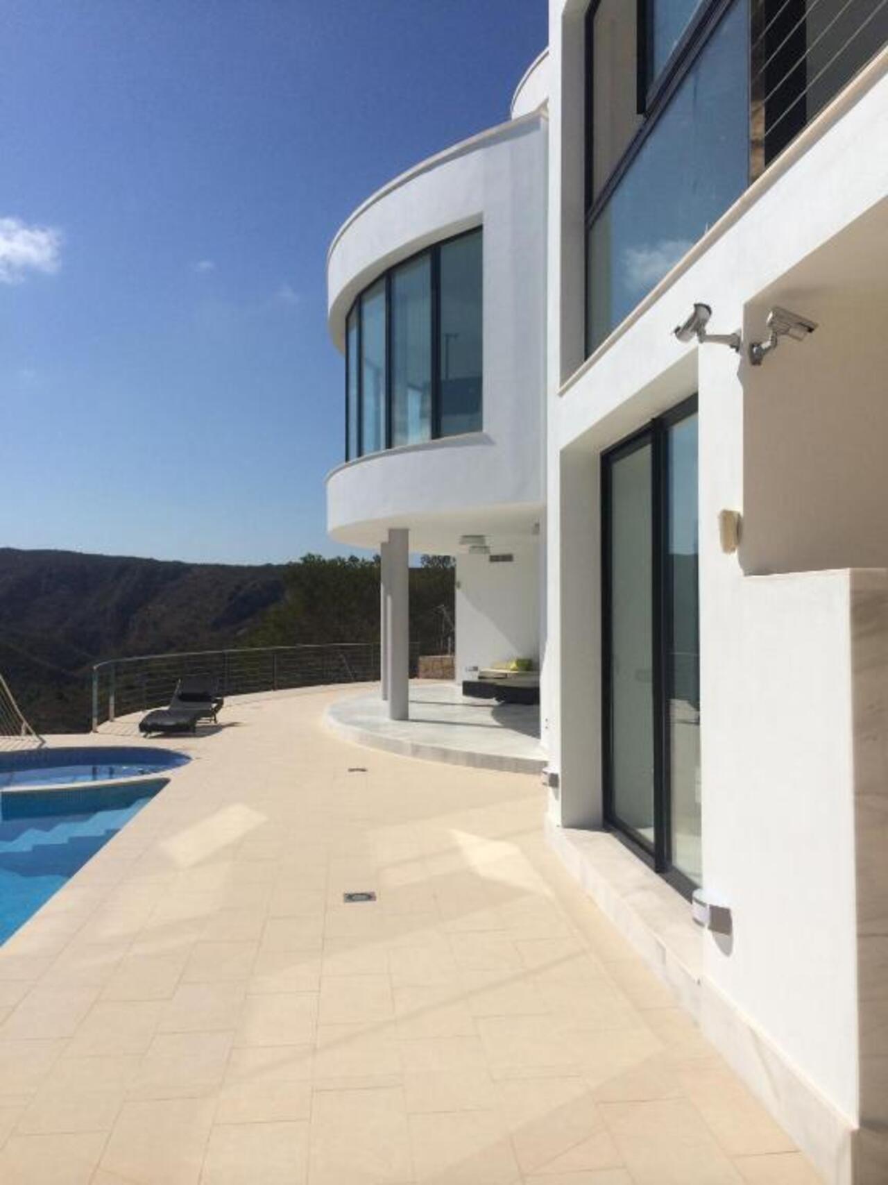 Spectacular First-Line 4-Bedroom Villa with Sea Views Near Granadella BeachNestled in an exclusive a
