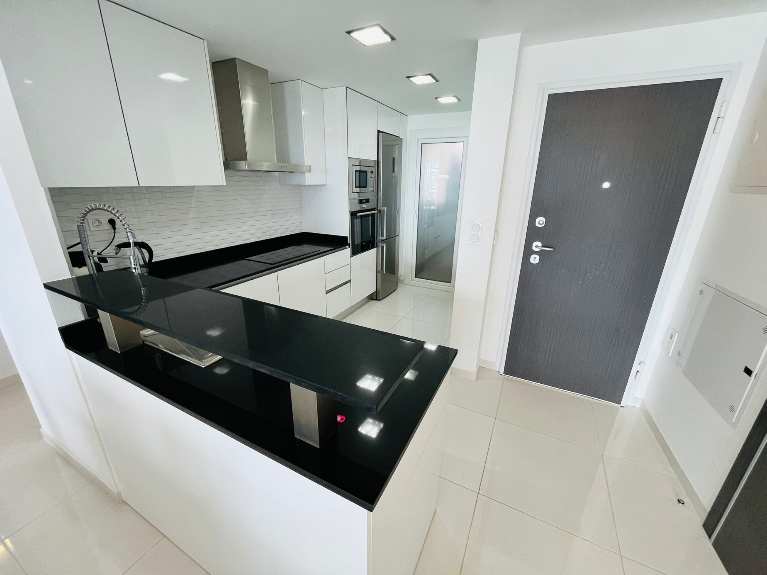 Pool area in apartment for sale in Punta Prima
