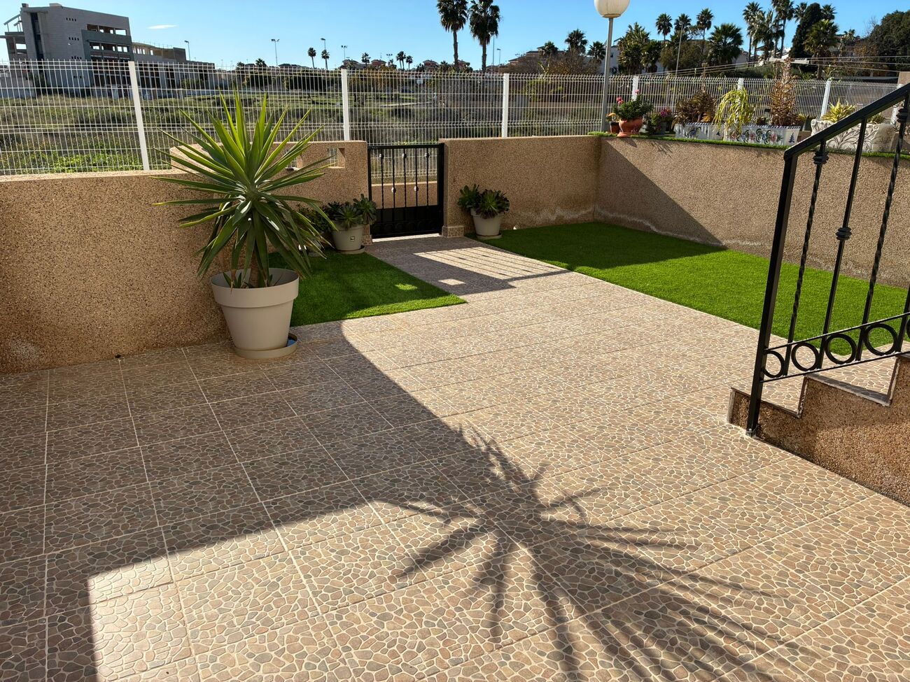 Pool area in apartment for sale in Punta Prima