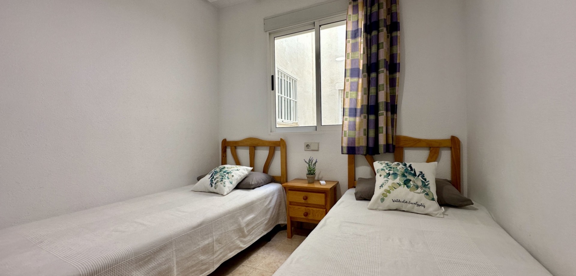 This bright and well-maintained apartment is located on the third floor of a modern building in the