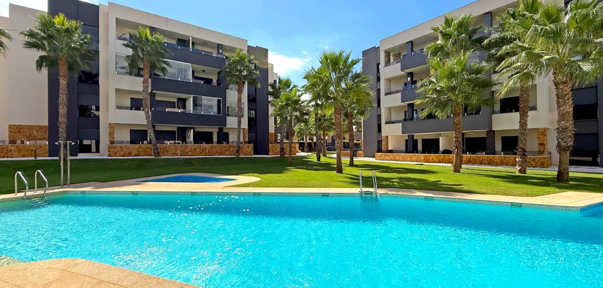 Located in a secure gated community in the heart of Los Altos, this stylish first-floor apartment co