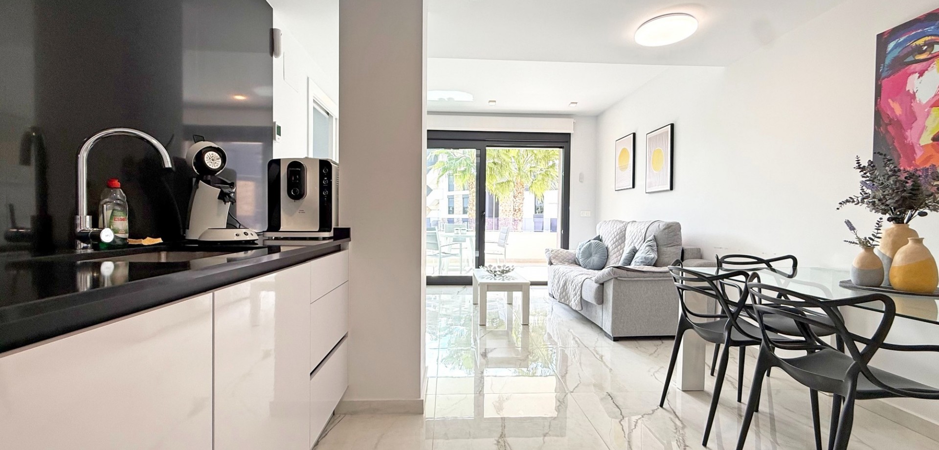 Located in a secure gated community in the heart of Los Altos, this stylish first-floor apartment co