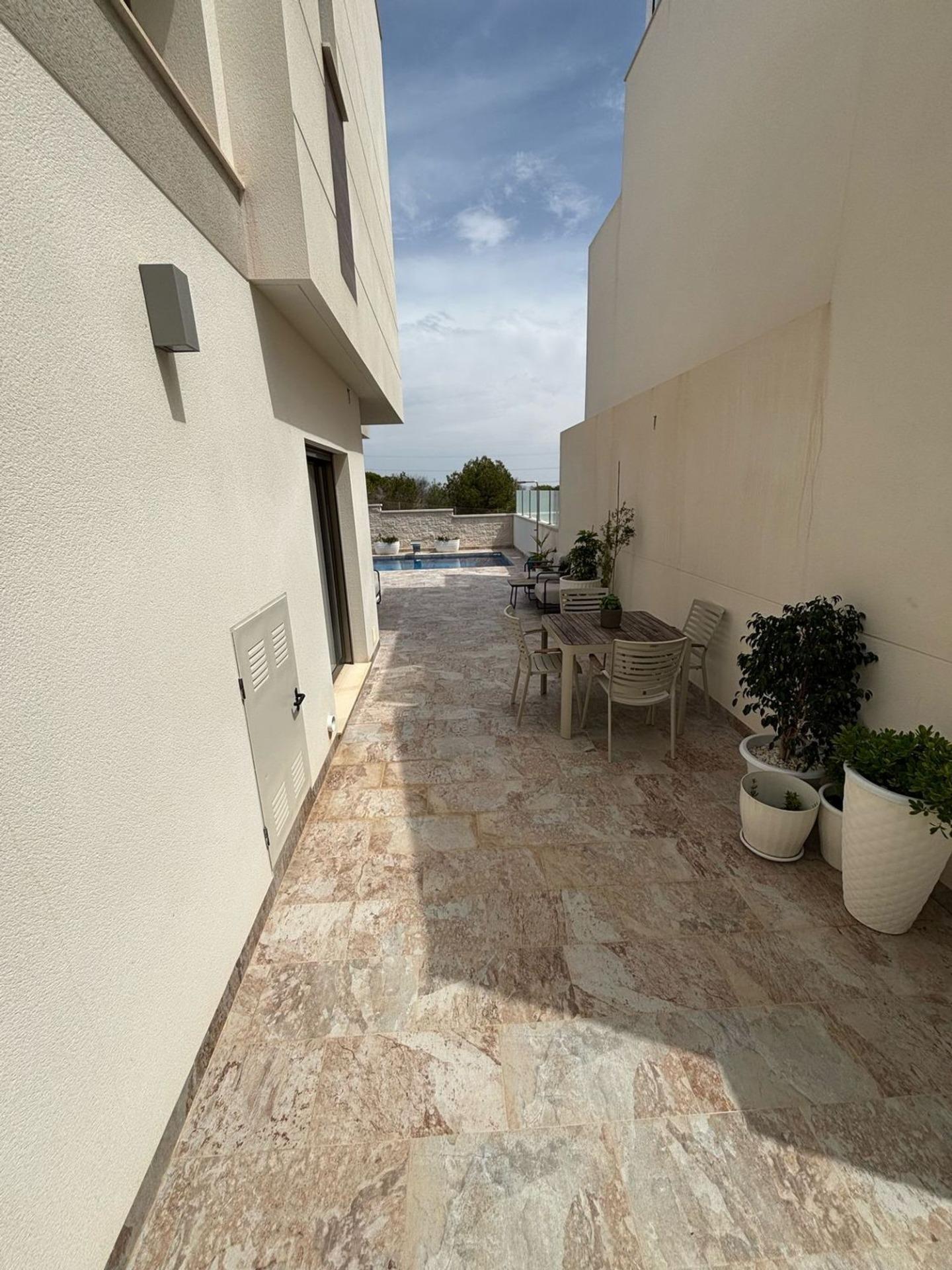 Pool area in villa for sale in Orihuela Costa