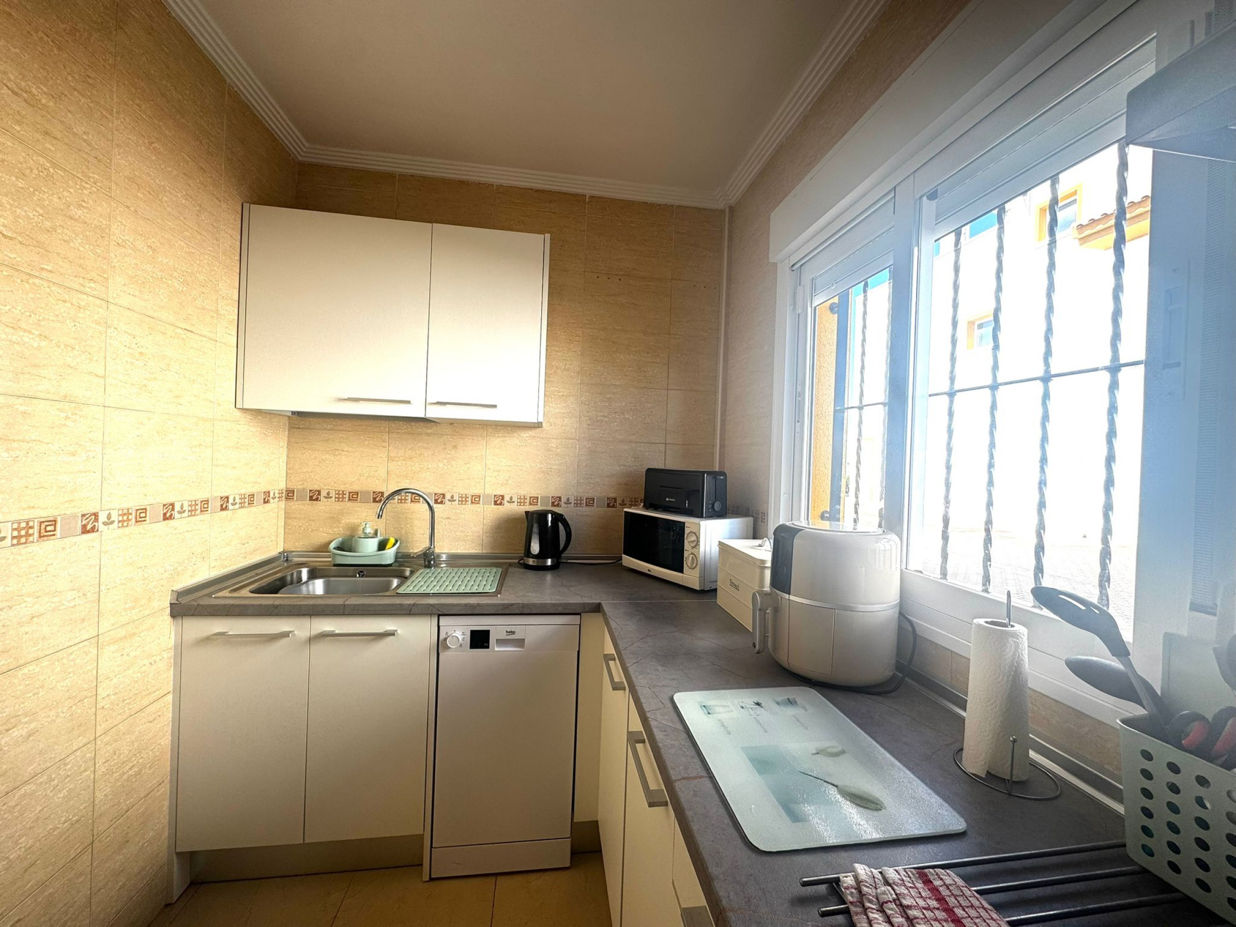 Discover your perfect Spanish retreat with this beautiful end townhouse, ideally situated on a priva