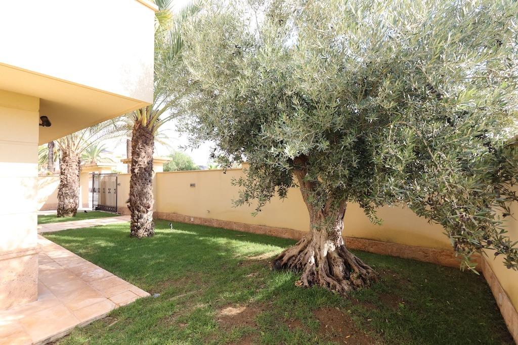 Pool area in villa for sale in Cabo Roig