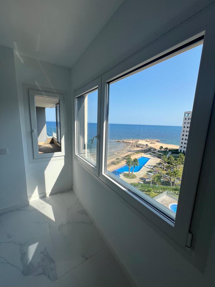Living room in apartment for sale in Punta Prima