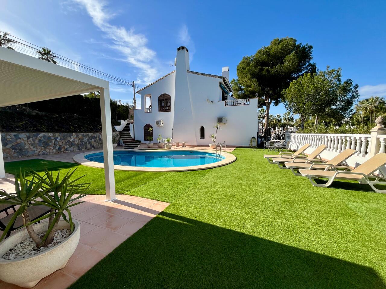 Pool area in villa for sale in Villamartin