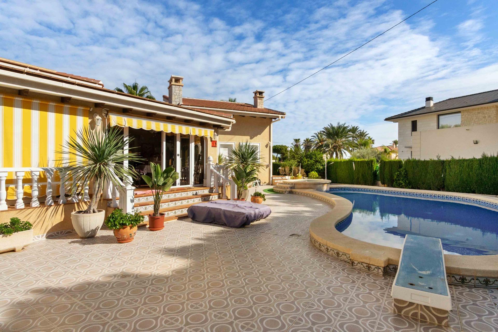 Pool area in villa for sale in Cabo Roig