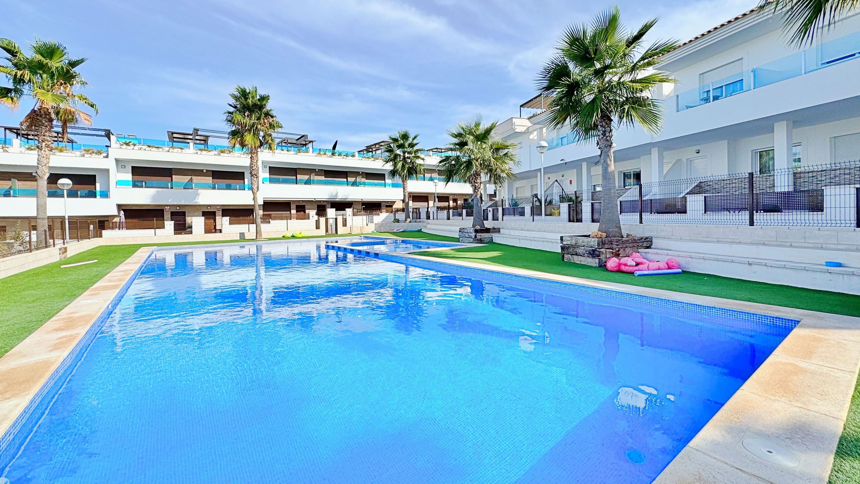 This three-bedroom, three-bathroom duplex townhouse is located in the exclusive residential area of