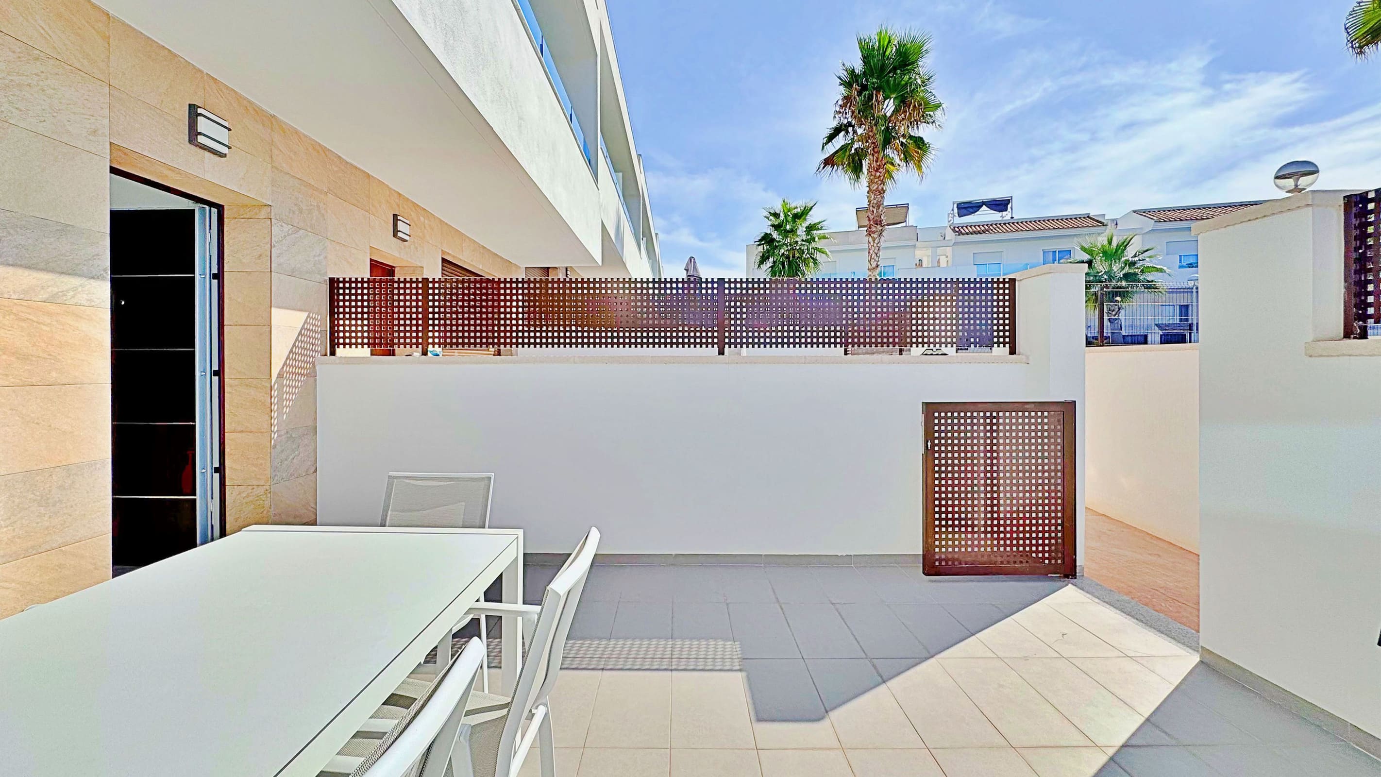 This three-bedroom, three-bathroom duplex townhouse is located in the exclusive residential area of