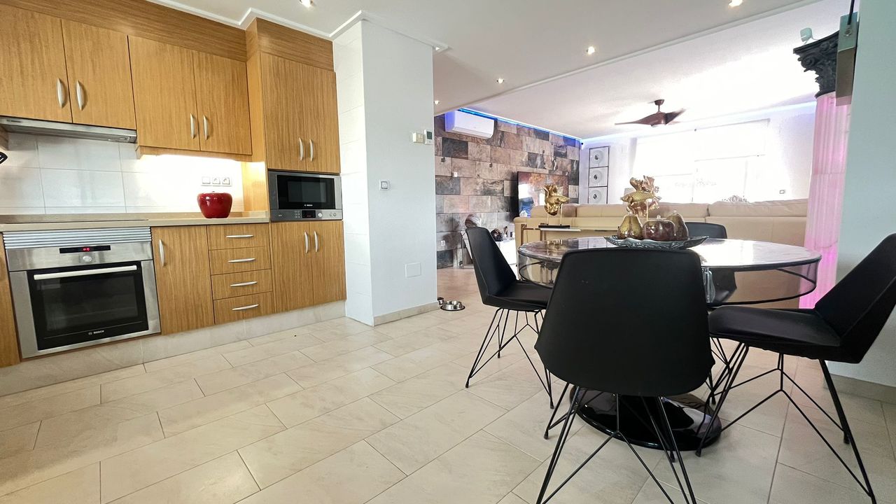 This impressive apartment features three spacious bedrooms with built-in wardrobes, along with the p