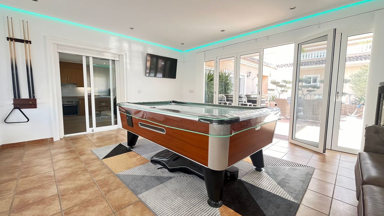 This impressive apartment features three spacious bedrooms with built-in wardrobes, along with the p