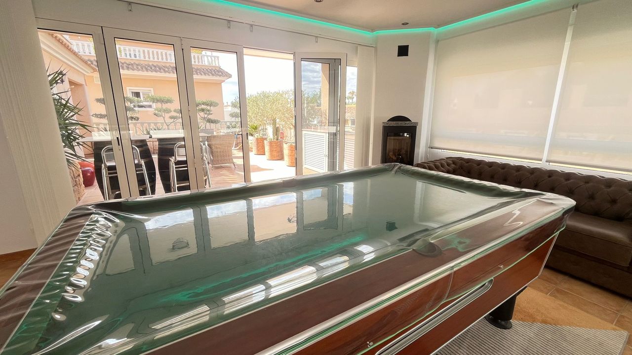 This impressive apartment features three spacious bedrooms with built-in wardrobes, along with the p
