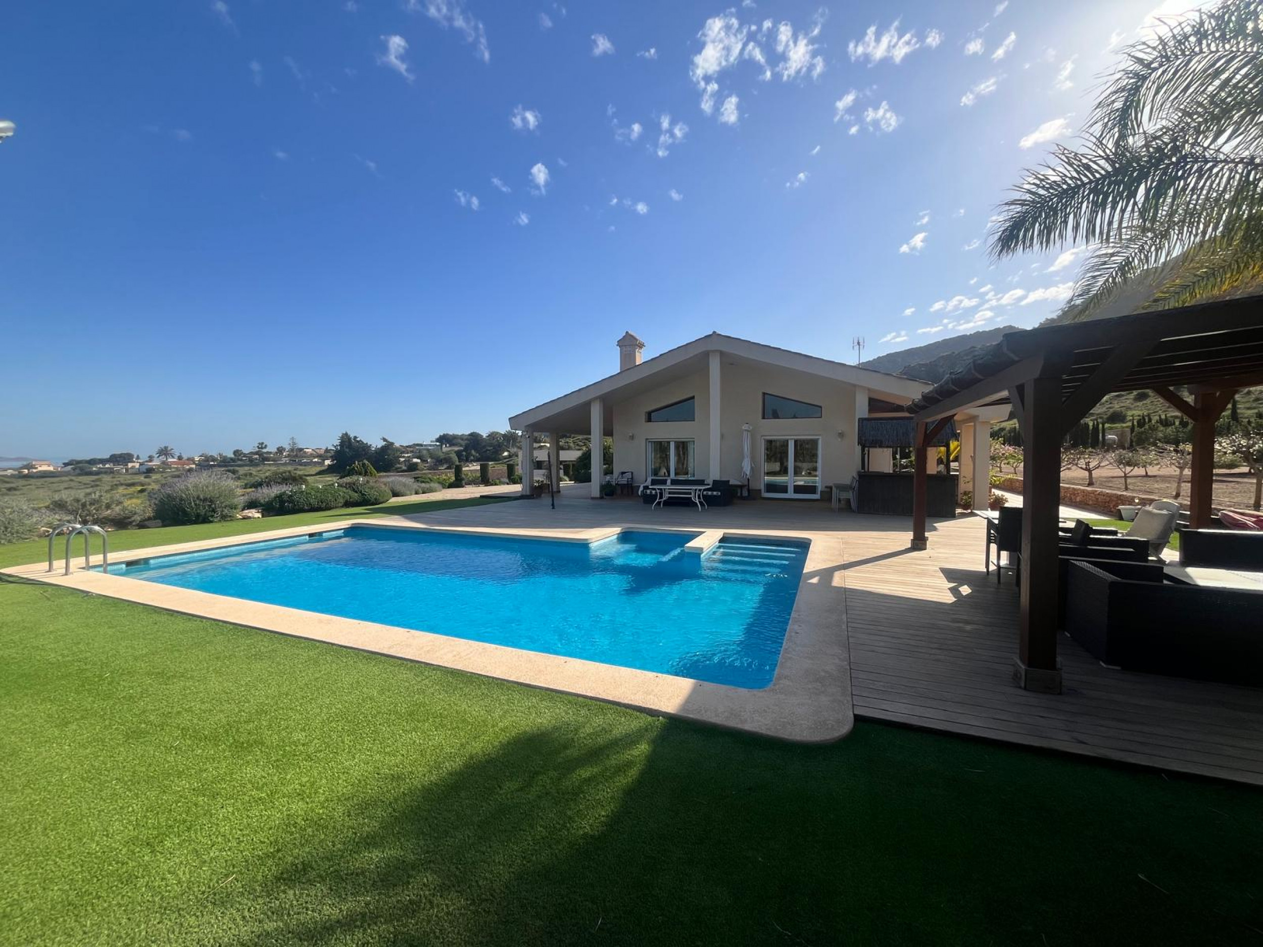 Pool area in villa for sale in Los Belones