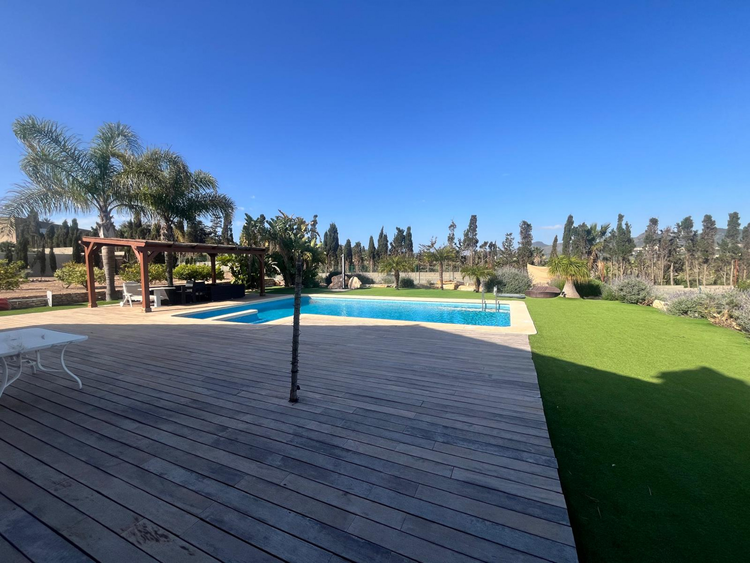 Pool area in villa for sale in Los Belones
