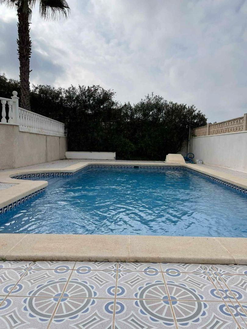 Pool area in villa for sale in Rojales