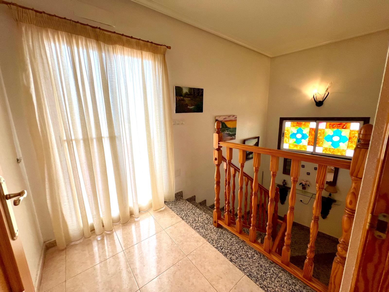 This well-maintained two-story semi-detached home in the town of Pinoso offers comfortable living wi