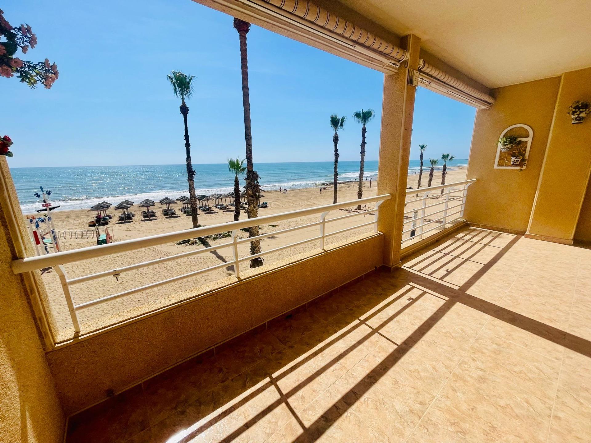 This spectacular first floor apartment is located on the first line of La Playa de La Mata, with imp