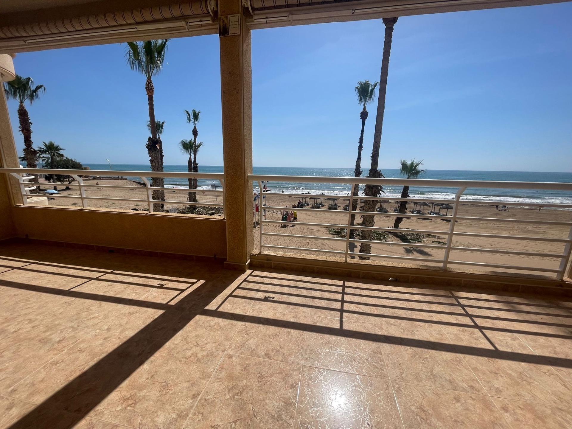 This spectacular first floor apartment is located on the first line of La Playa de La Mata, with imp