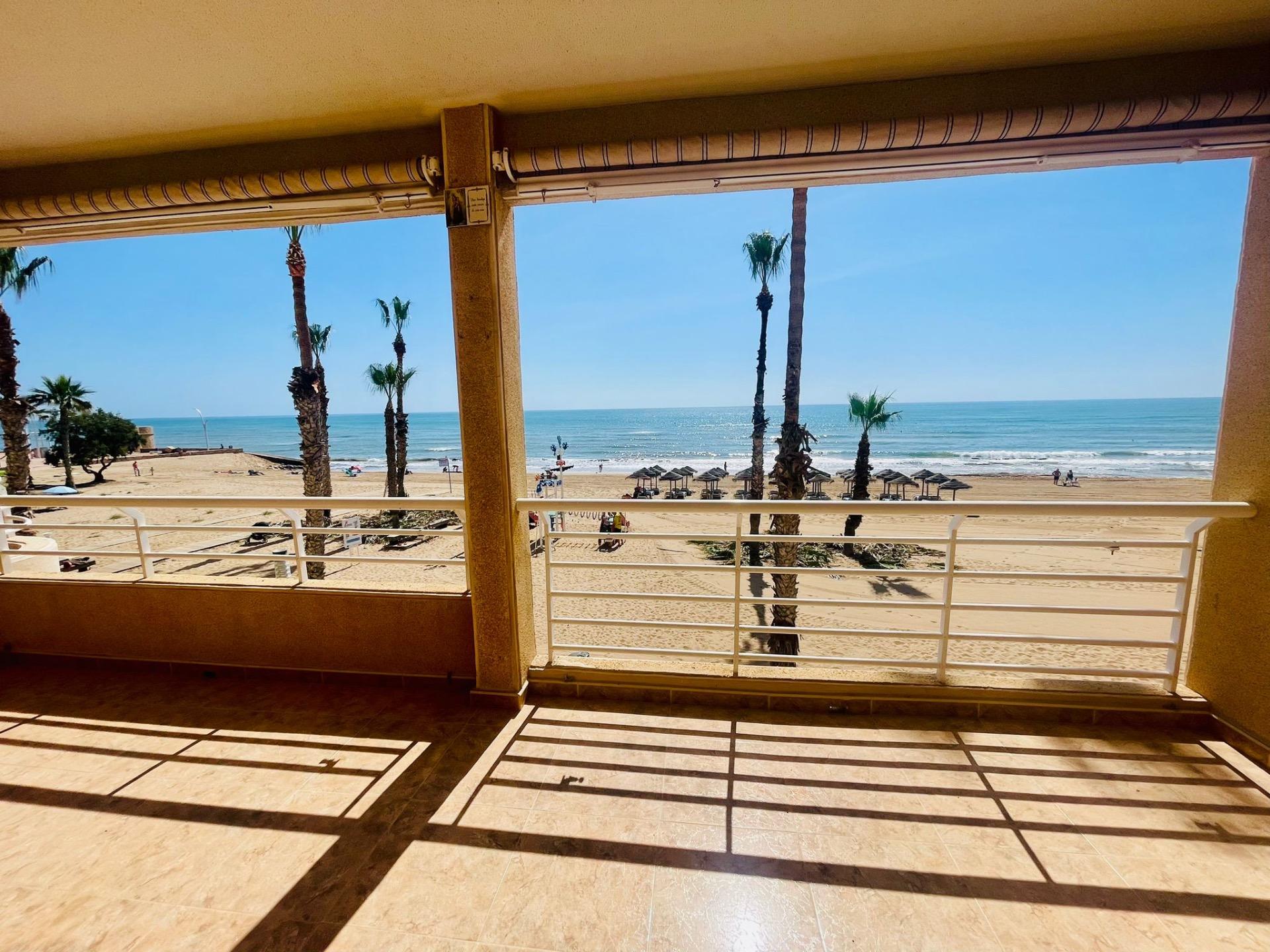 This spectacular first floor apartment is located on the first line of La Playa de La Mata, with imp
