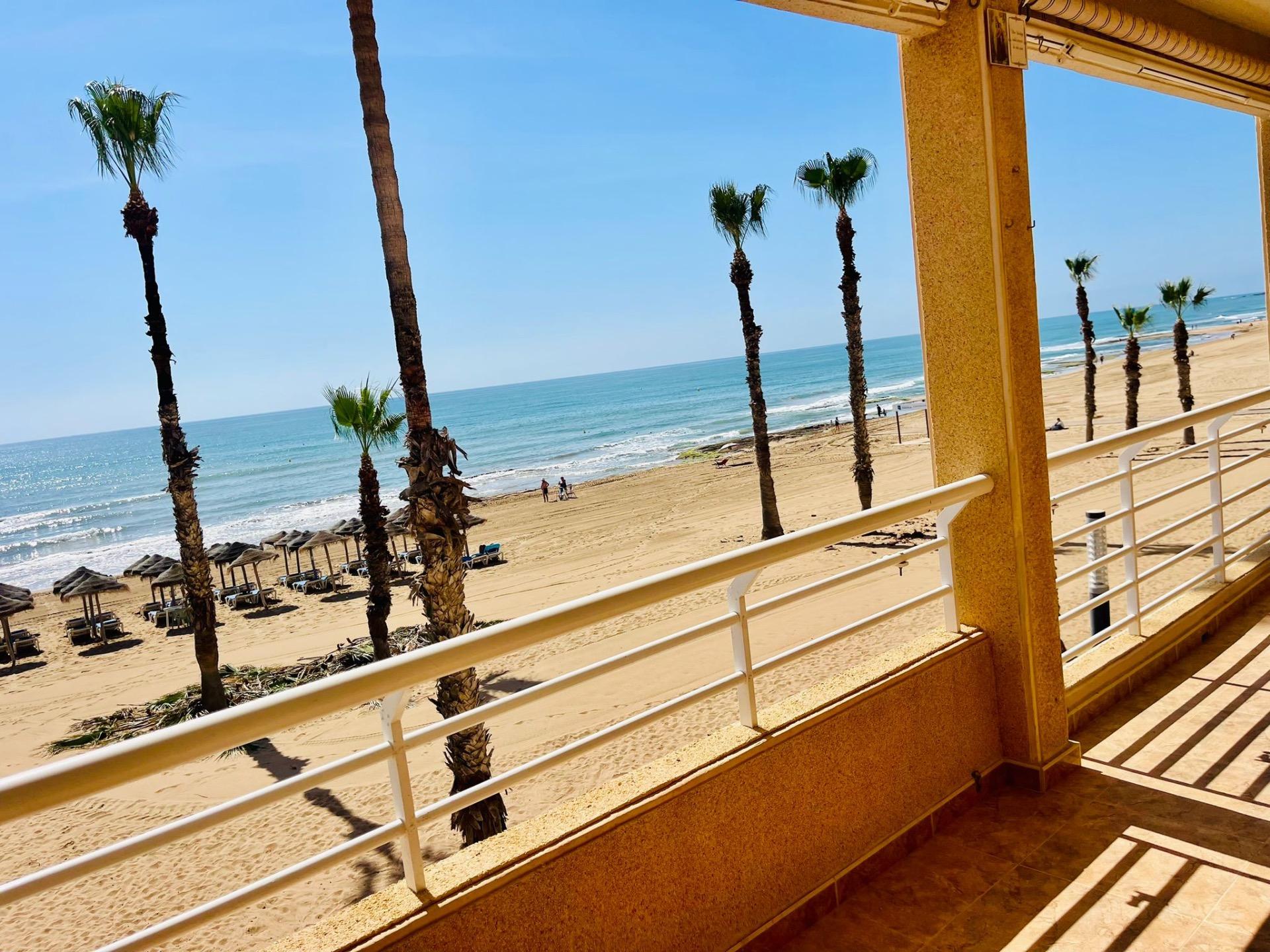 This spectacular first floor apartment is located on the first line of La Playa de La Mata, with imp