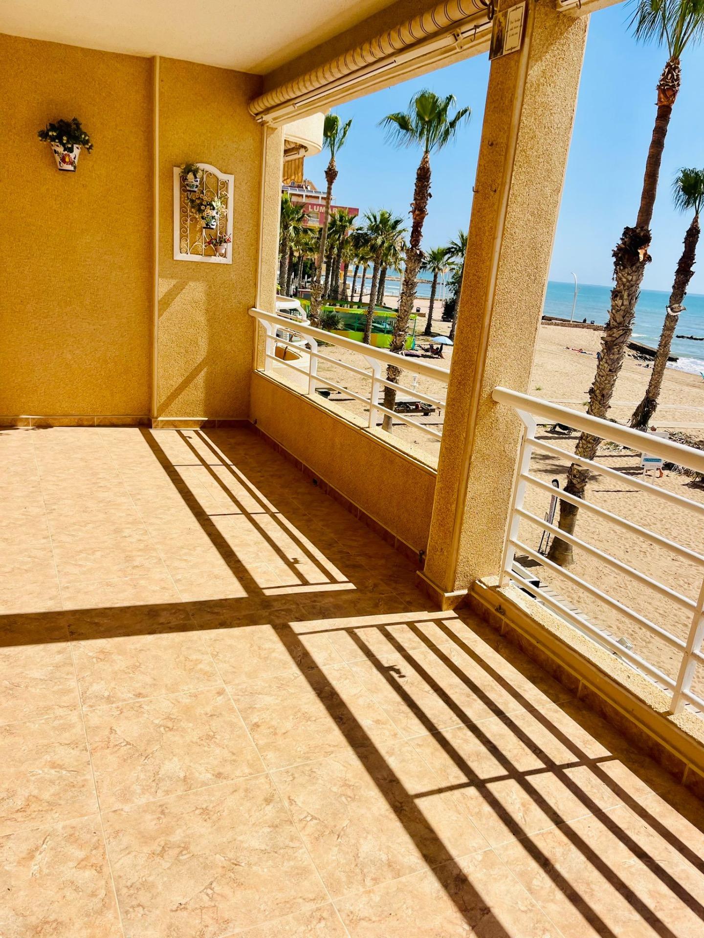 This spectacular first floor apartment is located on the first line of La Playa de La Mata, with imp