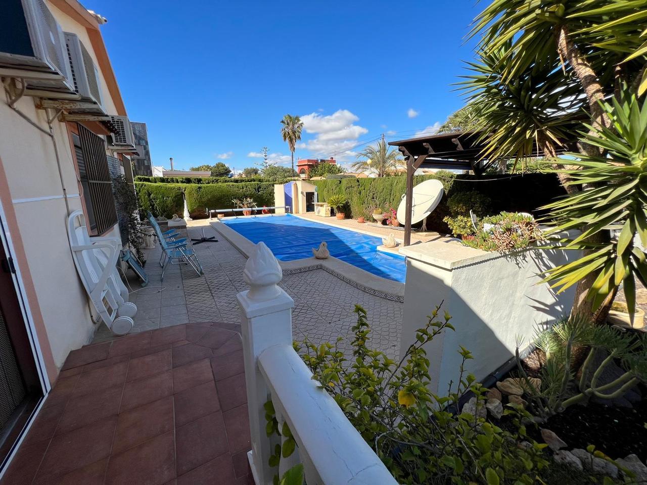 Pool area in villa for sale in Cabo Roig