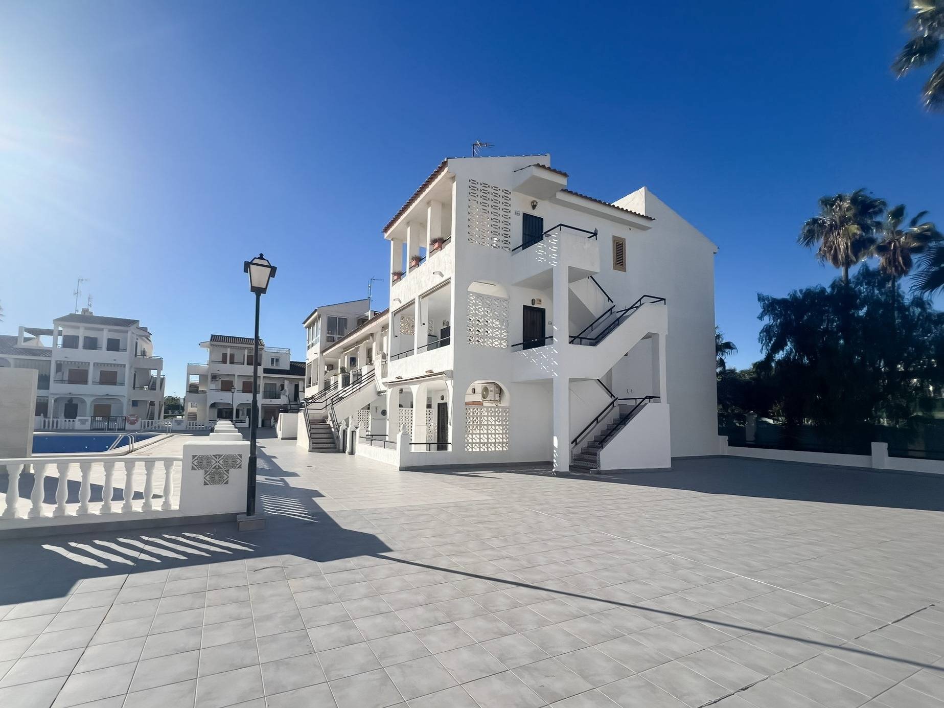 Pool area in bungalow for sale in Torrevieja