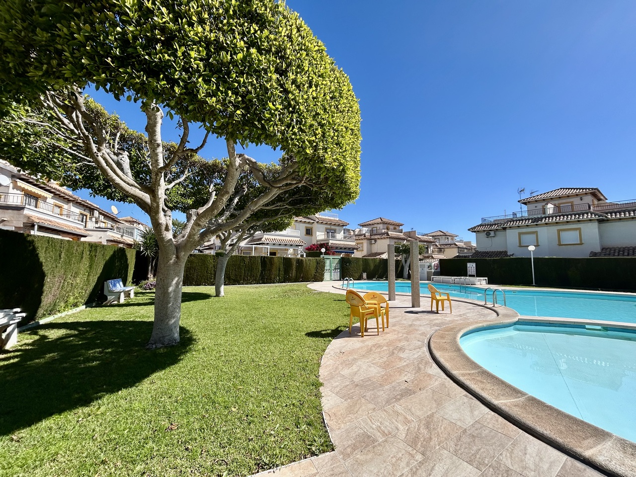 Pool area in apartment for sale in Punta Prima