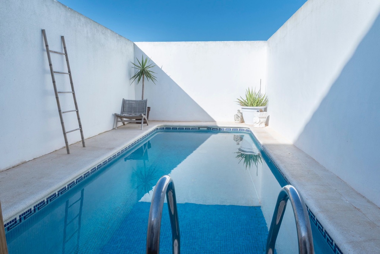 This spacious 4-bedroom townhouse offers the perfect combination of privacy, outdoor living, and con