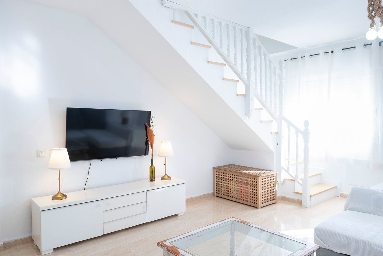 This spacious 4-bedroom townhouse offers the perfect combination of privacy, outdoor living, and con